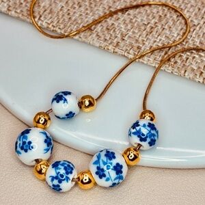 Free People Handcrafted Gold and Blue Floral Porcelain Bead Dainty Rope Necklace